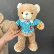 Игрушка уютный мишка в свитере 0